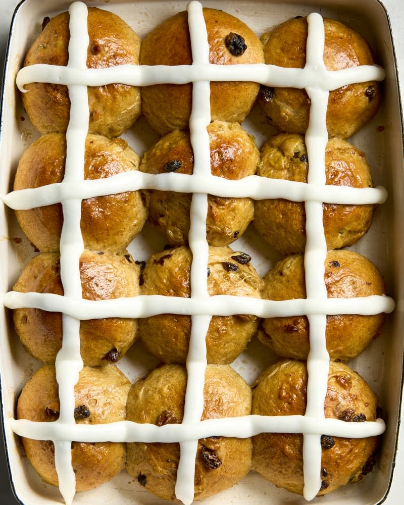 overhead shot of an entire baking dish of hot cross buns.