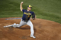 Milwaukee Brewers starting pitcher Brandon Woodruff throws during the first inning of a baseball game against the Chicago Cubs, Friday, Aug. 14, 2020, in Chicago. (AP Photo/Jeff Haynes)