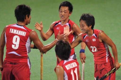 Japan's Tomonori Ono (R) and Takahiko Yamahori (L) during a field hockey match of the men's preliminary group B at the 16th Asian Games in Guangzhou in November 2010. Japan's men's field hockey team will be gunning to take full advantage of home soil to book their first Olympic ticket in 44 years