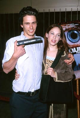 James Franco holds up his copy of "Crack In America" while Marla Sokoloff assures people that James only PLAYED a freak on "Freaks and Geeks" at the Egyptian Theatre premiere of Artisan's Requiem For A Dream