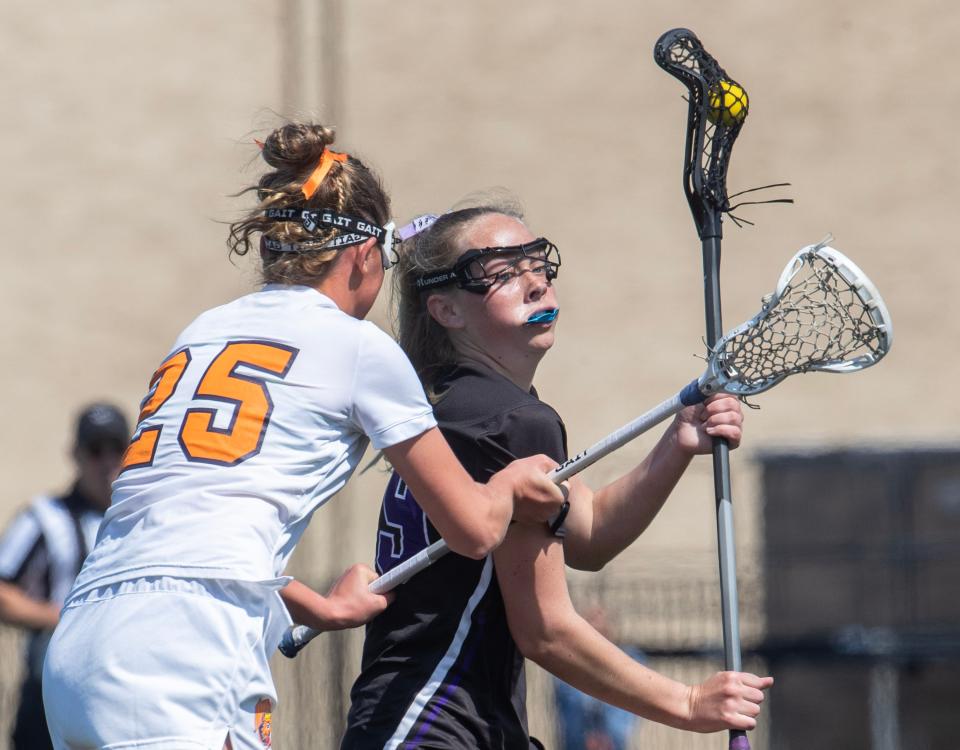 Rumson’s Rachel James tries to work in towards goal against Hall’s Winnie Popham. Rumson-Fair Haven Girls Lacrosse defeat Trinity Hall 17-6 in Shore Conference Tournament Finals in West Long Branch, NJ on May 20, 2024.