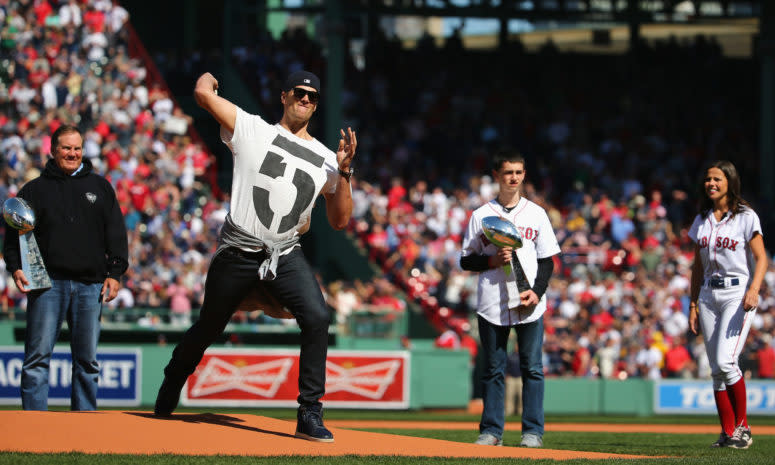 Tom brady throws the first pitch at a Red Sox game.