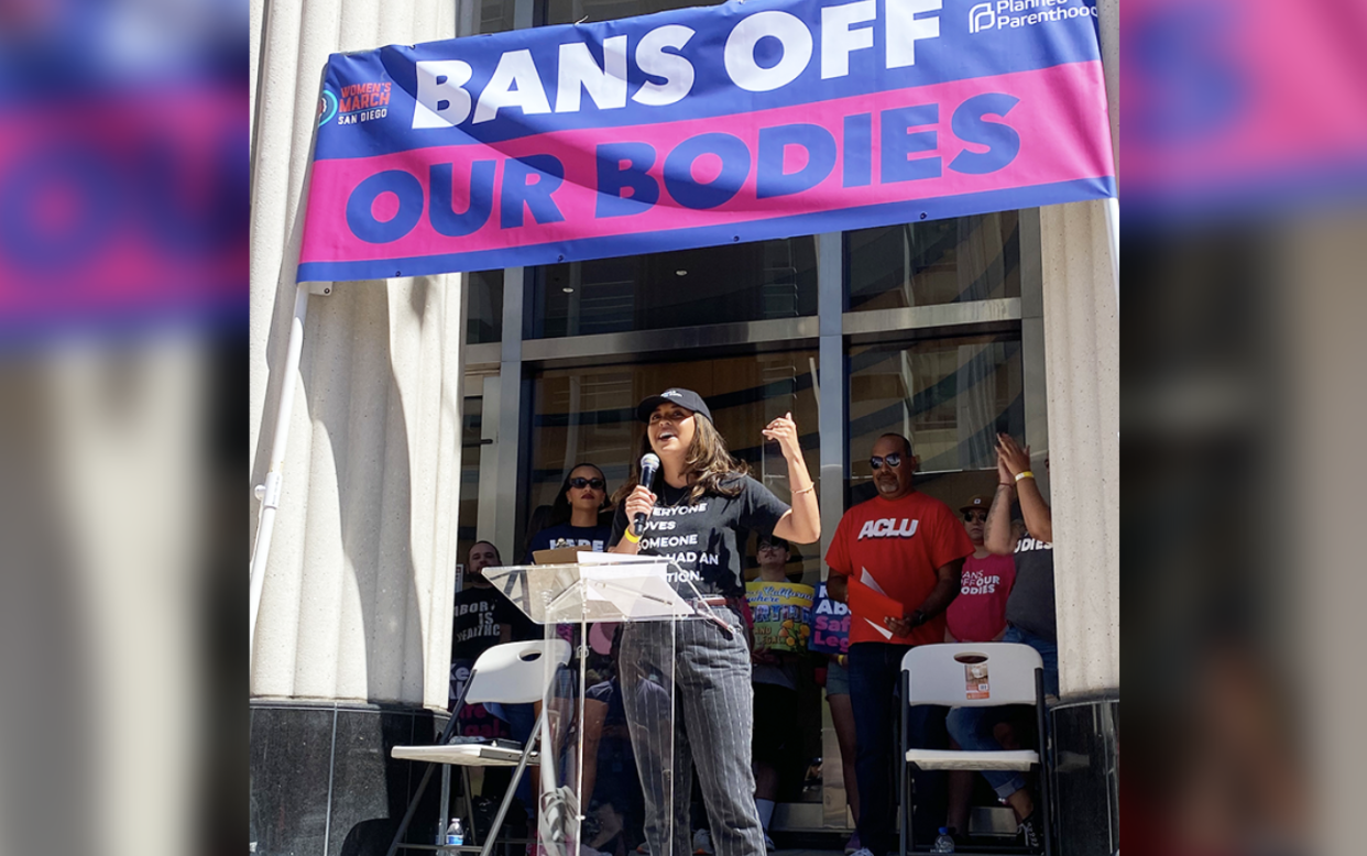 Jessy Rosales spoke at a San Diego "Bans Off Our Bodies" rally in May. During college at UC Riverside, Rosales was a coordinator for the justCARE Campaign which supported SB 24, The "College Student Right to Access Act."