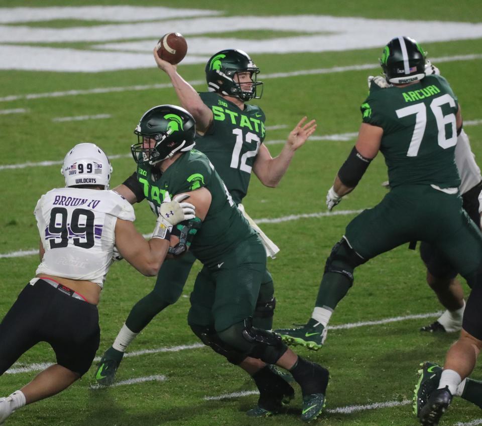 Michigan State quarterback Rocky Lombardi passes during MSU's 29-20 win over Northwestern at Spartan Stadium on Saturday, Nov. 28, 2020.