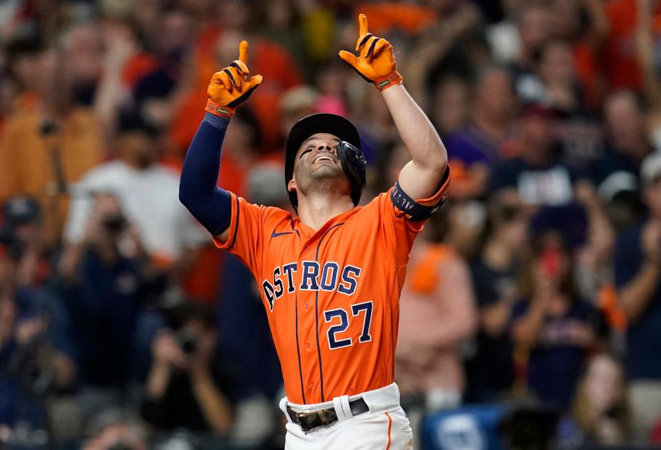 Houston Astros second baseman Jose Altuve (27) celebrates after hitting a solo home run against Atlanta during the seventh inning in Game 2 of the World Series.