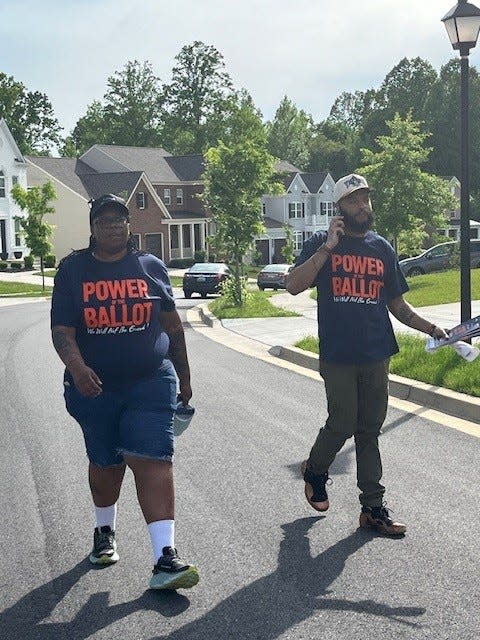 Prince Hamn, (right) and Tiffani Evans canvas a predominately Black neighborhood May 8, 2024 ahead of Maryland's May 14 primary.