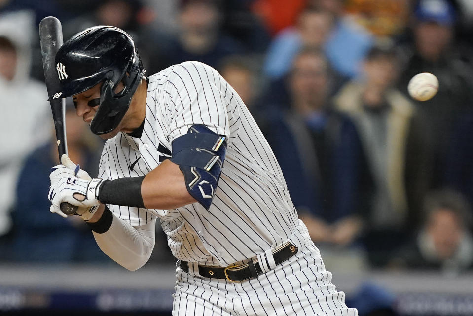 New York Yankees right fielder Aaron Judge (99) dodges a pitch during the second inning of Game 4 of an American League Championship baseball series against the Houston Astros, Sunday, Oct. 23, 2022, in New York. (AP Photo/John Minchillo)