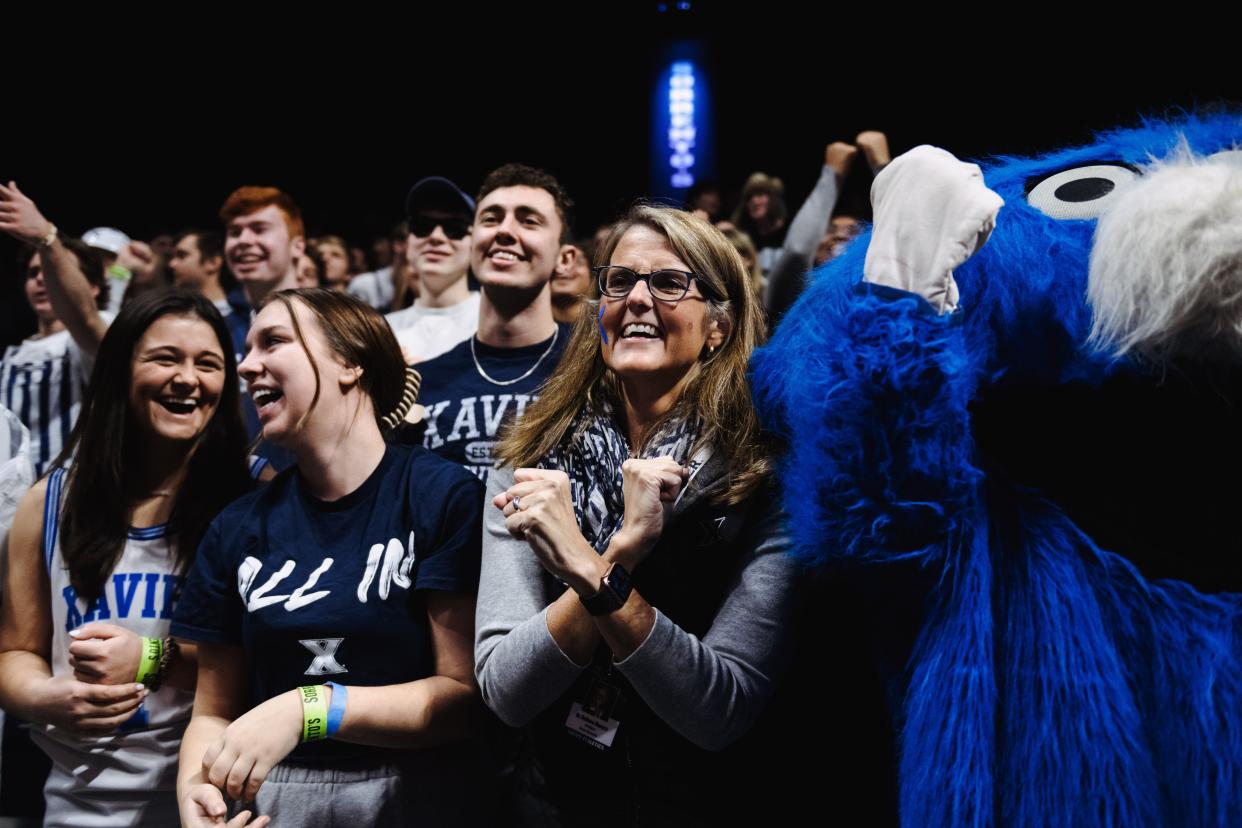 Xavier University President Dr. Colleen Hanycz started a new tradition recently, joining the student section to cheer during Xavier men's basketball home games.