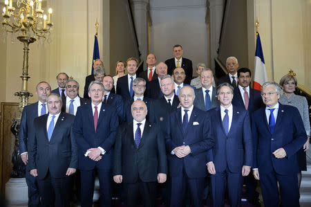 Iraqi Prime Minister Haider al-Abadi (3rdL) and French Foreign Affairs Minister Laurent Fabius (3rdR) pose for a family photo with Foreign Affairs Ministers and members of the anti-Islamic State coalition in Paris, France, June 2, 2015. REUTERS/Stephane De Sakutin/Pool