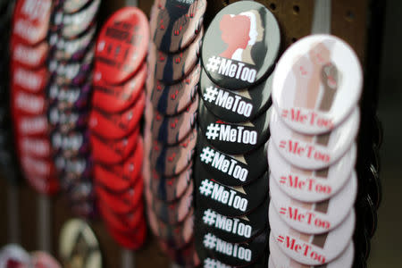 A vendor sells #MeToo badges a protest march for survivors of sexual assault and their supporters in Hollywood, Los Angeles, California U.S. November 12, 2017. REUTERS/Lucy Nicholson/Files