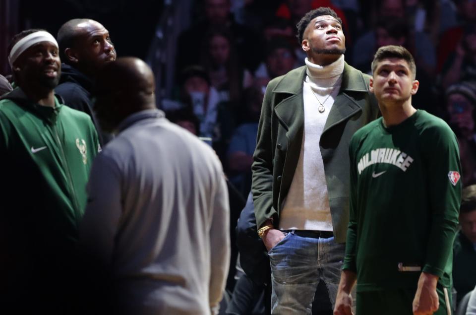 Milwaukee Bucks forward Giannis Antetokounmpo watches  a video recognizing him becoming the team's all-time leading scorer during the first half of their game against the Los Angeles Clippers Friday, April 1, 2022 at Fiserv Forum in Milwaukee, Wis.