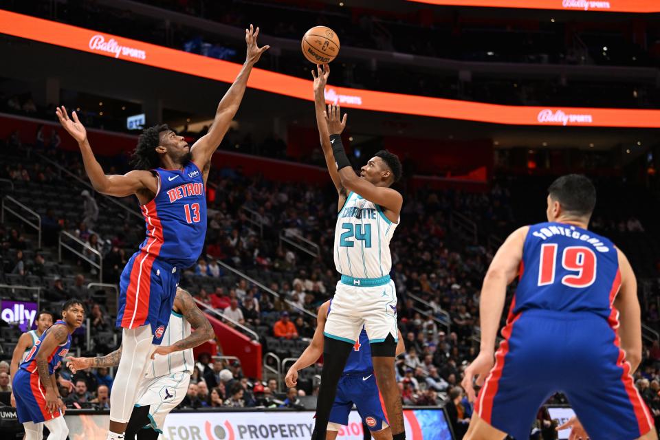 Charlotte Hornets forward Grant Williams (2) shoots the ball over Detroit Pistons center James Wiseman (13) in the second quarter at Little Caesars Arena in Detroit on Monday, March 11, 2024.