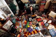 Harry Potter fan Victoria Maclean poses amongst her collection of merchandise at her home in Neath, Britain, February 9, 2017. REUTERS/Neil Hall