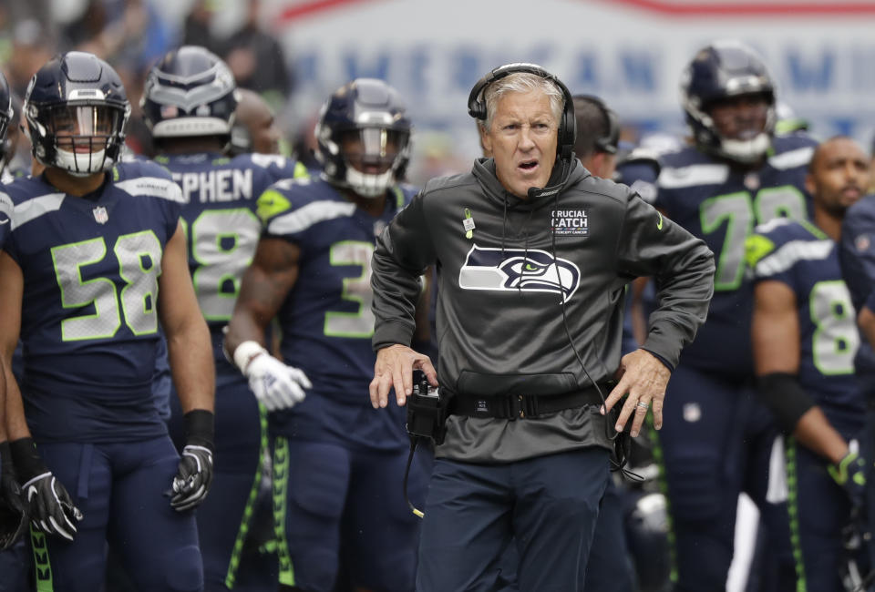 Seattle Seahawks head coach Pete Carroll walks the sideline during the second half of an NFL football game against the Los Angeles Rams, Sunday, Oct. 7, 2018, in Seattle. (AP Photo/Elaine Thompson)