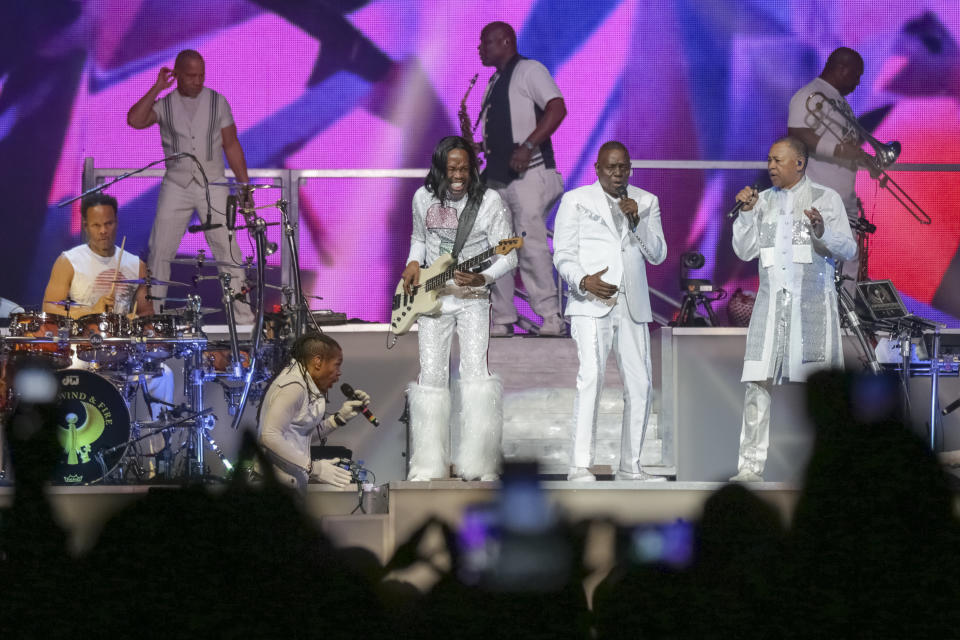 FILE - In this Aug. 9, 2017 file photo, Earth, Wind and Fire performs on stage at the Verizon Center on in Washington. Iconic actress Sally Field and foundational children’s show Sesame Street top this year’s class of Kennedy Center Honors recipients. Other chosen to receive the award for lifetime achievement in the arts include singer Linda Ronstadt, conductor Michael Tilson Thomas and the R&B group Earth, Wind and Fire.(Photo by Brent N. Clarke/Invision/AP)