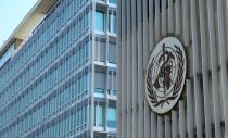 A logo is pictured on the headquarters of the WHO in Geneva