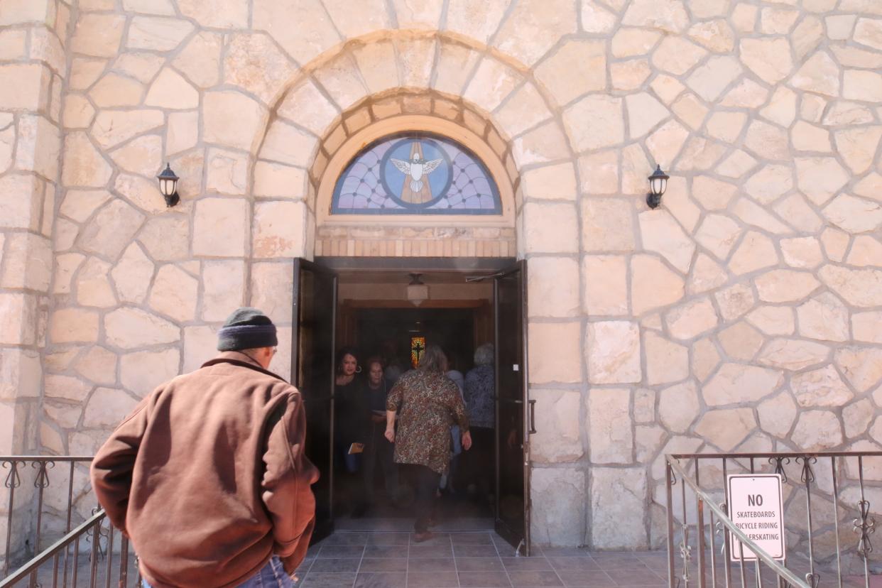 Attendees exit the church after an Ash Wednesday mass, March 6, 2019 at St Edward Catholic Church.