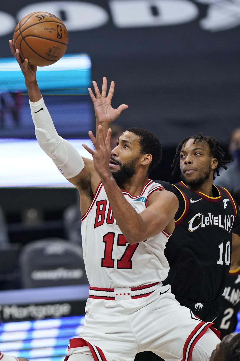 Chicago Bulls' Garrett Temple (17) drives to the basket against Cleveland Cavaliers' Darius Garland (10) during the first half of an NBA basketball game Wednesday, April 21, 2021, in Cleveland. (AP Photo/Tony Dejak)