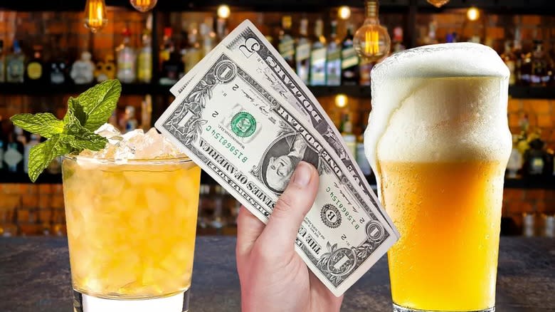 Cocktail, beer, and hand holding tip