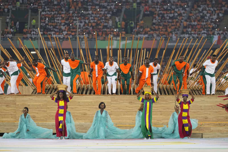 Artists perform during the opening ceremony of the Africa Cup of Nations 2024 at the Alassane Ouattara Olympic Stadium. -/CSM via ZUMA Press Wire/dpa