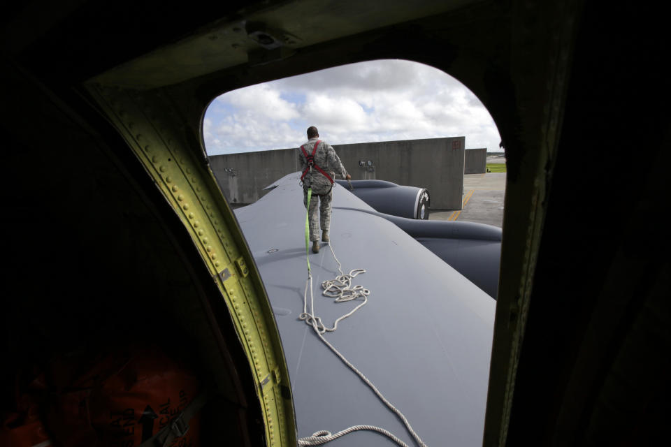 In this Aug. 14, 2012 photo, ground crew member Staff Sgt. Jonathan Price, of Butler, PA, walks on the wing of a U.S. Air Force KC-135 Stratotanker, which was built in 1958, at Kadena Air Base on Japan's southwestern island of Okinawa. For decades, the U.S. Air Force has grown accustomed to such superlatives as unrivaled and unbeatable. Now some of its key aircraft are being described with terms like decrepit. (AP Photo/Greg Baker)