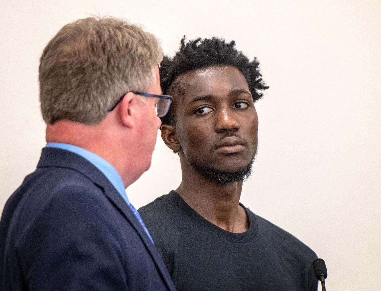 Caleb Boateng is arraigned in Central District Court Tuesday. Lawyer Sean McGinty, left, represented Boateng.