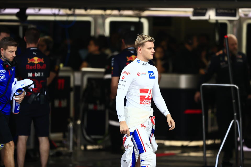 Haas driver Mick Schumacher, of Germany, walks in pit lane during the qualifying run of the Formula One Mexico Grand Prix at the Hermanos Rodriguez racetrack in Mexico City, Saturday, Oct. 29, 2022. (Carlos Perez Gallardo/Pool via AP)