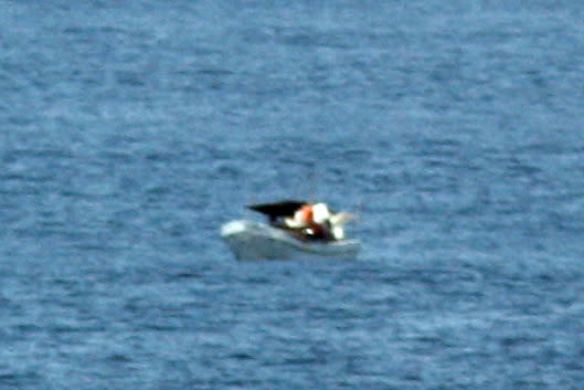 This March 10, 2012 photo provided by Jeff Gilligan, a passenger of the American-based cruise ship Star Princess, shows a fishing vessel adrift in the Pacific Ocean off the Galapagos Islands. Gilligan and another American aboard the cruise ship, in the same area, believe they saw the fishermen adrift at sea and they alerted the crew, but the luxury liner continued on its course. Two of the three men in the fishing vessel died from exposure. The company that owns the Star Princess cruise ship says it is looking into whether the crew ignored the fishermen's signals that they needed help.  (AP Photo/Jeff Gilligan)