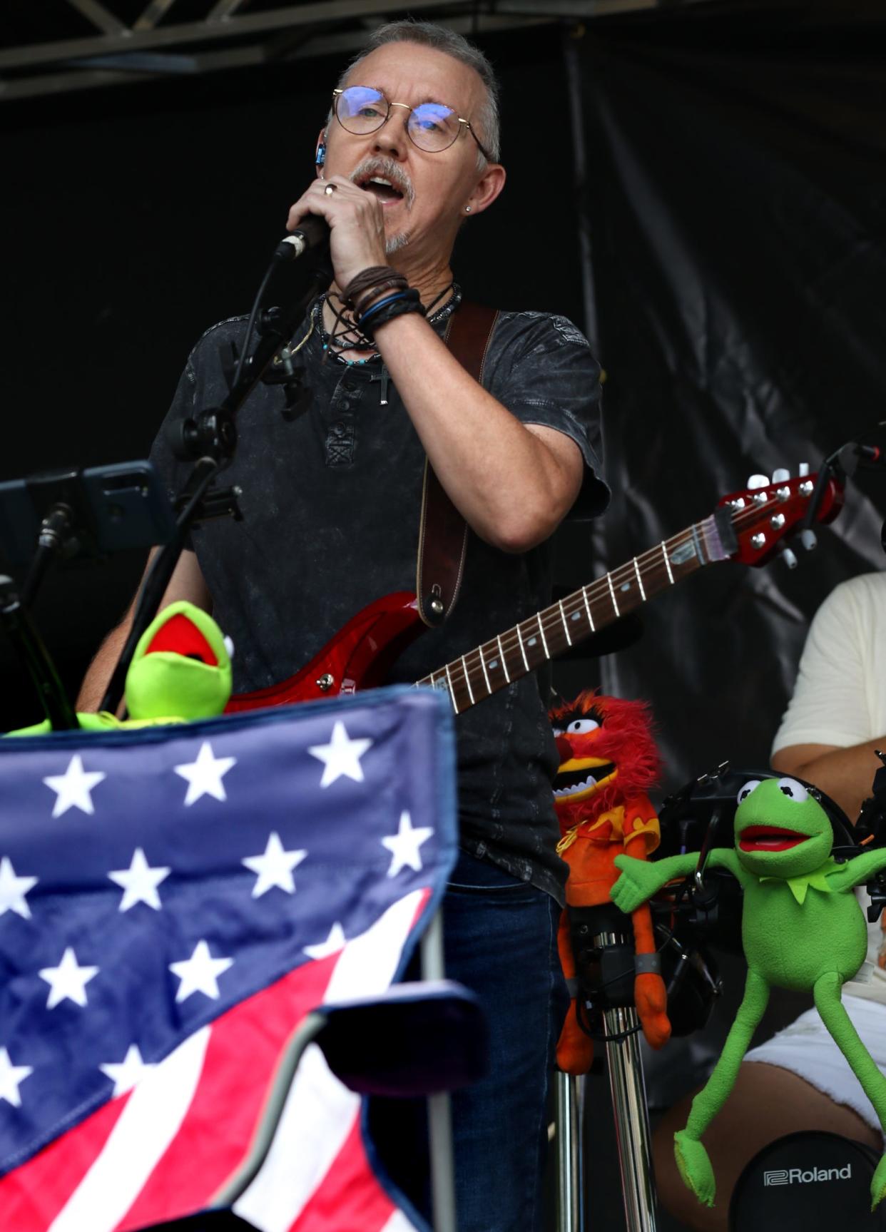 Tangerine Trees’ lead singer, Roger Leonhardt, sings the national anthem at the opening of North Carolina American Legion 7th Inning Stretch Festival held Saturday, Aug. 6, 2022, in Uptown Shelby.