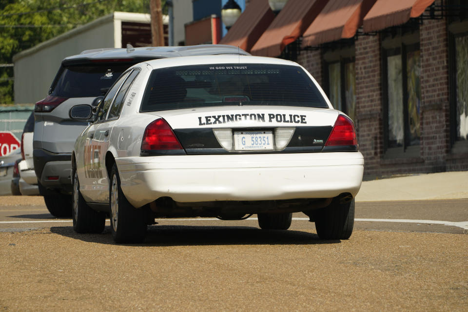 A Lexington, Miss., police cruiser patrols near the town square, Monday, Aug. 15, 2022. A civil rights and international human rights organization filed a federal lawsuit on Tuesday, against local officials in Lexington, where they say police have "terrorized" residents, subjecting them to false arrests, excessive force and intimidation. (AP Photo/Rogelio V. Solis)