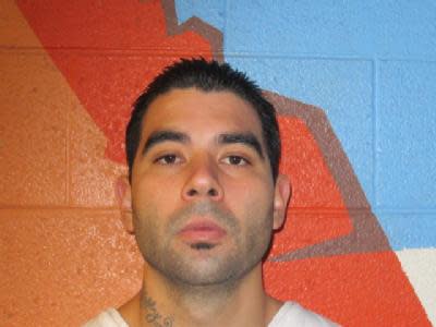 In this undated photo provided by the Utah Department of Corrections shows Jose Angel Garcia Juaregui. Officials say Utah County sheriff's Sgt. Cory Wride had stopped to check on a truck that appeared to be disabled on a two-lane highway Thursday, Jan. 30, 2014 afternoon. He was using his computer to do a background check when he was shot from the truck and killed. Utah County sheriff's officials identified the shooter as 27-year-old Jose Angel Garcia Juaregui. (AP Photo/Utah Department of Corrections)