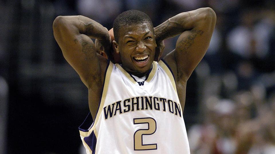 <div>Nate Robinson of Washington grimaces after picking up his fourth foul during 66-63 victory over Stanford in the Pacific Life Pac-10 Tournament men's basketball semifinals at the Staples Center in Los Angeles, California on Friday, March 11, 2005. (Photo by Kirby Lee/Getty Images)</div>