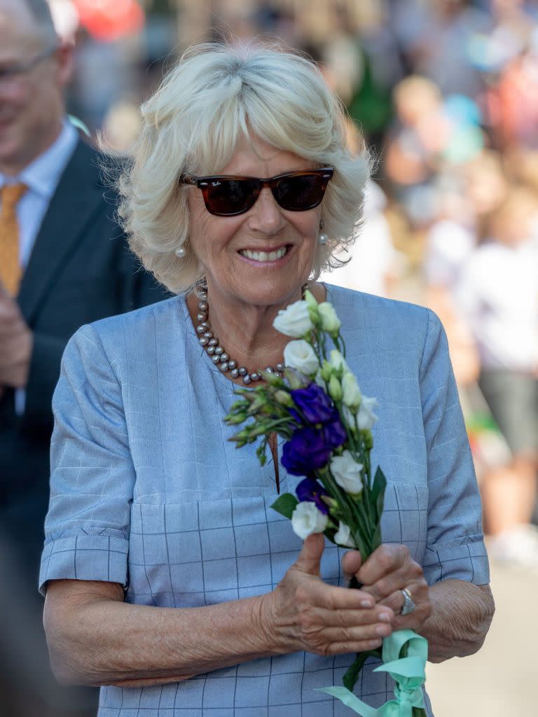 <p>The Duchess of Cornwall wore a simple blue patterned dress, which she accessorized with a gray pearl necklace, pearl earrings, and brown Ray-Ban sunglasses while on a royal visit with Prince Charles in Wales.<br><br><a class="link " href="https://go.redirectingat.com?id=74968X1596630&url=https%3A%2F%2Fshop.nordstrom.com%2Fs%2Fray-ban-standard-50mm-folding-wayfarer-sunglasses%2F3236463%3Forigin%3Dkeywordsearch-personalizedsort%26color%3Dbrown%2Bflash&sref=https%3A%2F%2Fwww.townandcountrymag.com%2Fstyle%2Ffashion-trends%2Fg14510433%2Fcamilla-parker-bowles-fashion-style%2F" rel="nofollow noopener" target="_blank" data-ylk="slk:SHOP NOW;elm:context_link;itc:0;sec:content-canvas">SHOP NOW</a> <em>Folding Wayfarer Sunglasses, $153</em></p>