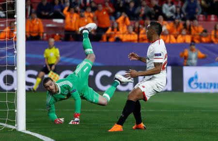 Soccer Football - Champions League Round of 16 First Leg - Sevilla vs Manchester United - Ramon Sanchez Pizjuan, Seville, Spain - February 21, 2018 Manchester United's David De Gea makes a save from Sevilla’s Luis Muriel REUTERS/Juan Medina