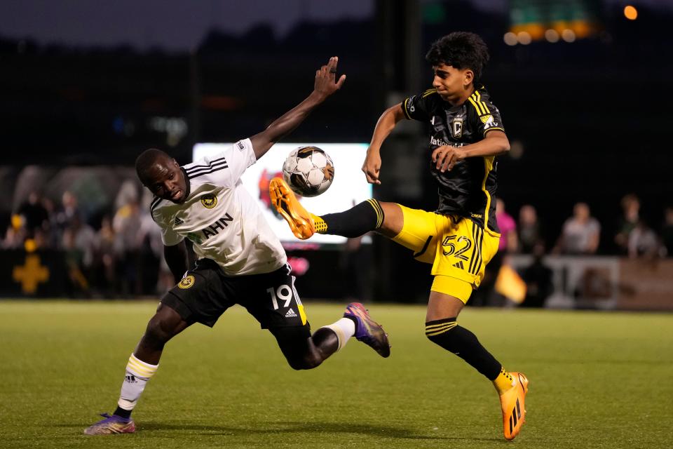 Crew midfielder Taha Habroune (52) kicks the ball away from Pittsburgh Riverhounds forward Edward Kizza during a U.S. Open Cup match on May 24.