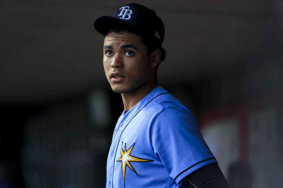Tampa Bay Rays' Taj Bradley watches from the dugout during the fifth inning of the team's baseball game against the Cincinnati Reds in Cincinnati, Tuesday, April 18, 2023. (AP Photo/Aaron Doster)
