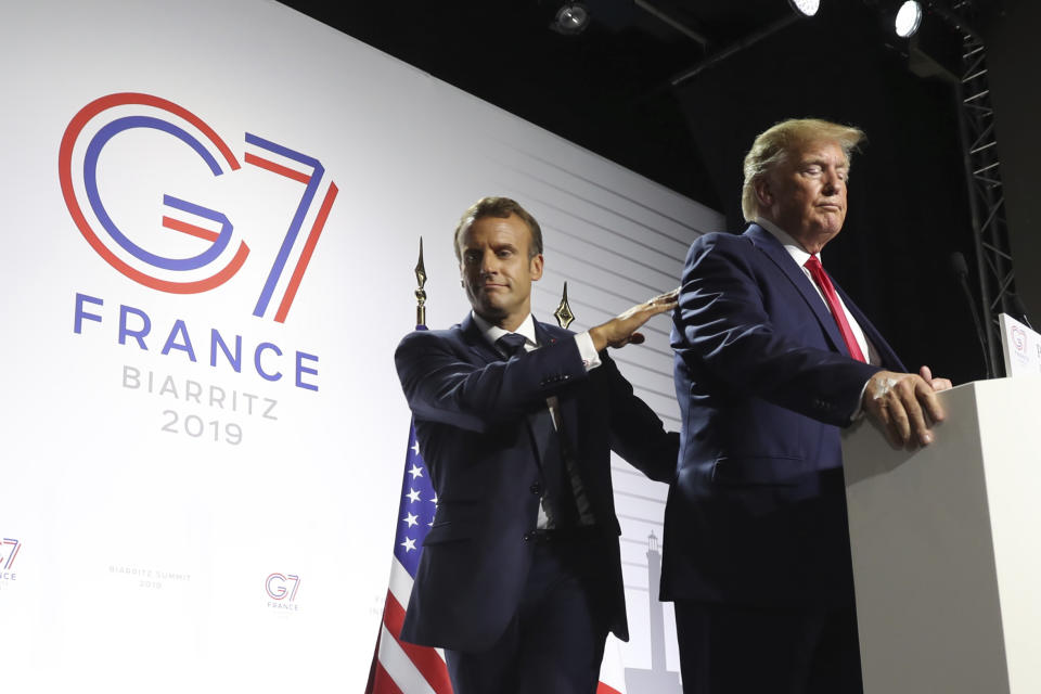 French President Emmanuel Macron wraps up a joint press conference with President Donald Trump at the G-7 summit in Biarritz, France, Monday, Aug. 26, 2019. Trump remained to take additional questions. (AP Photo/Andrew Harnik)