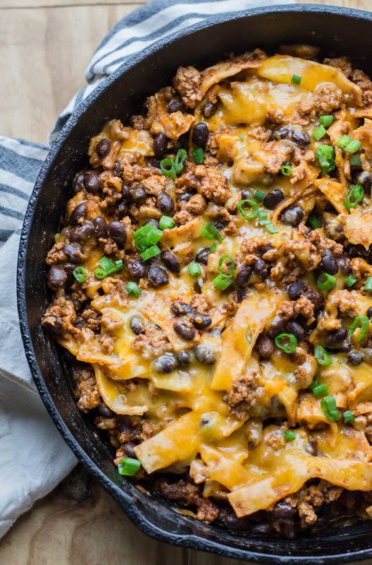 <p>Mae Bells</p><p>Ground beef, black beans, a flavorful enchilada sauce, tortillas and cheese come together for a one-pan, 20-minute meal!</p><p><strong>Get the recipe: <a href="https://www.maebells.com/one-pan-enchilada/" rel="nofollow noopener" target="_blank" data-ylk="slk:One-Pan Enchiladas;elm:context_link;itc:0;sec:content-canvas" class="link ">One-Pan Enchiladas</a></strong></p>