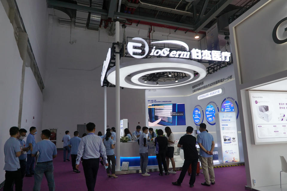 Shanghai-based testing kit company BioGerm presents a booth at a trade fair in Nanchang in eastern China's Jiangxi province on Friday, Aug. 21, 2020. BioGerm was one of three companies that gained privileged access to crucial information on the coronavirus from the Chinese Center for Disease Control and Prevention at the beginning of the outbreak, allowing them to make kits ahead of competitors. The move delayed China's response to the outbreak and caused critical shortages of kits. (AP Photo/Dake Kang)