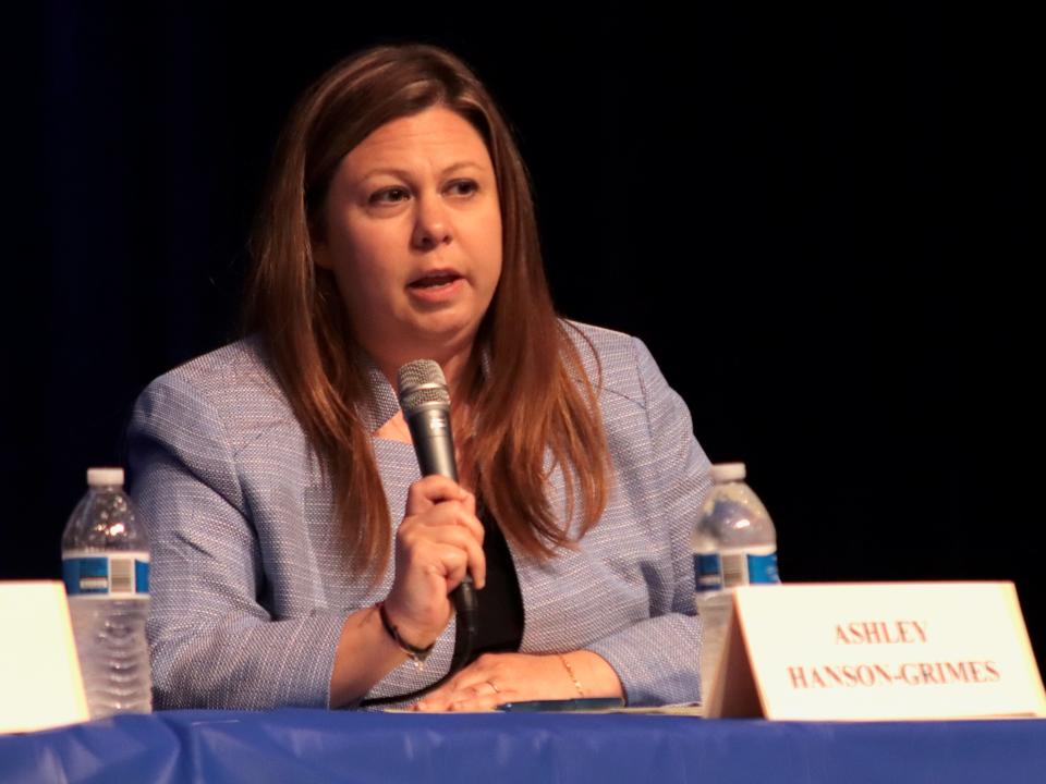 Ashley Hanson-Grimes, a candidate for Lenawee County district judge, answers a question during a forum Thursday at Adrian High School.