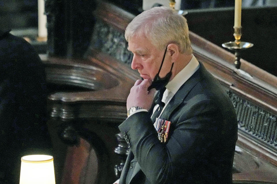 FILE — Britain's Prince Andrew inside St. George's Chapel during the funeral of his father, Prince Philip, at Windsor Castle, Windsor, England, April 17, 2021. When Jeffrey Epstein’s longtime companion Ghislaine Maxwell goes on trial next week, the accuser who captivated the public most, with claims she was trafficked to Britain’s Prince Andrew and other prominent men, won’t be part of the case. (Yui Mok/Pool via AP, File)