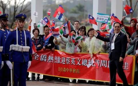 Members of the Taiwanese community in Paraguay greet President Tsai during a visit last week - Credit: Jorge Adorno/Reuters