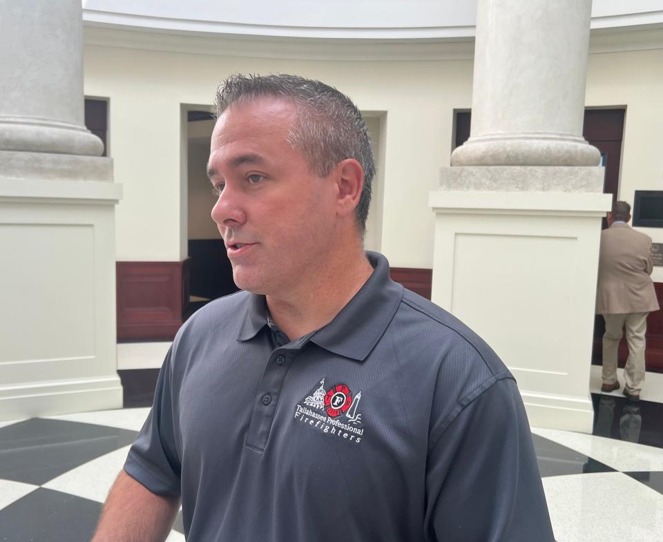 Tallahassee Firefighters Union President Joey Davis speaks to reporters outside of a Florida Commission on Ethics hearing on June 3, 2022