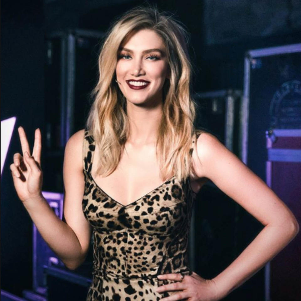 Delta Goodrem using the peace gesture on The Voice. Source: Channel Nine