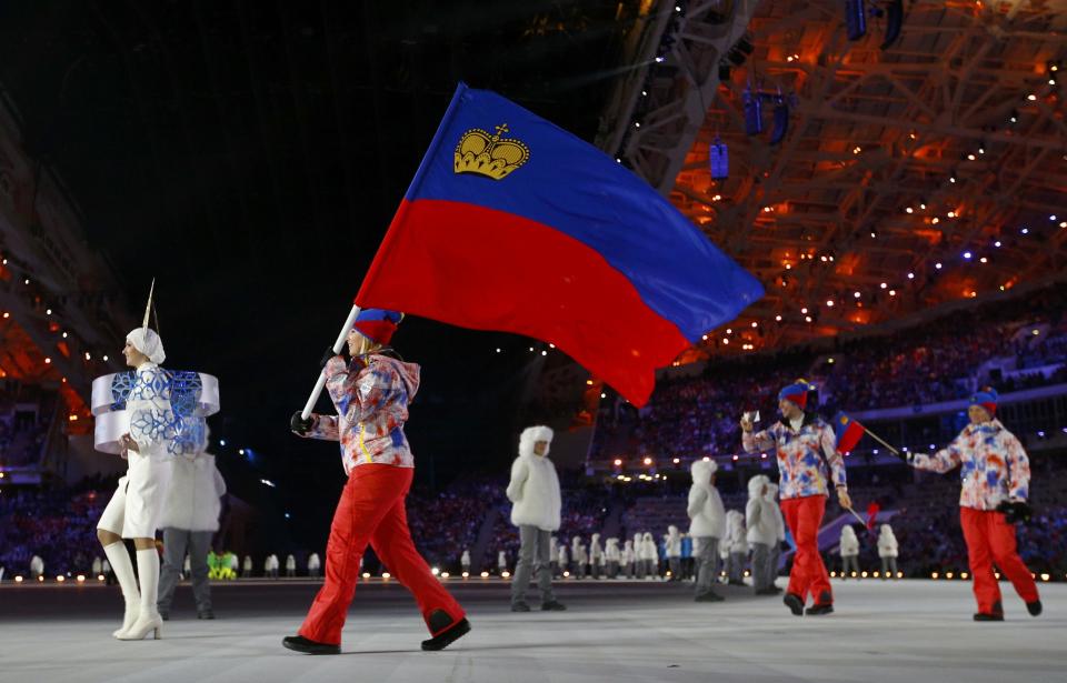 Liechtenstein's flag-bearer Tina Weirather leads her country's delegation during the opening ceremony of the 2014 Sochi Winter Olympic Games at Fisht stadium February 7, 2014. REUTERS/Brian Snyder (RUSSIA - Tags: OLYMPICS SPORT)