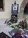 Flowers are placed next to a memorial plaque commemorating Jan Palach at Charles University in Prague, Czech Republic, January 16, 2019. REUTERS/Jiri Skacel