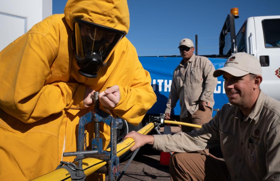 Tirso Brunk (left), from Tonopah Valley High School, fixes a mock gas leak with the help of Jonathan Gritti (right), from Southwest Gas, during Arizona Construction Career Days at the Arizona National Guard in Phoenix on Nov. 1, 2023.