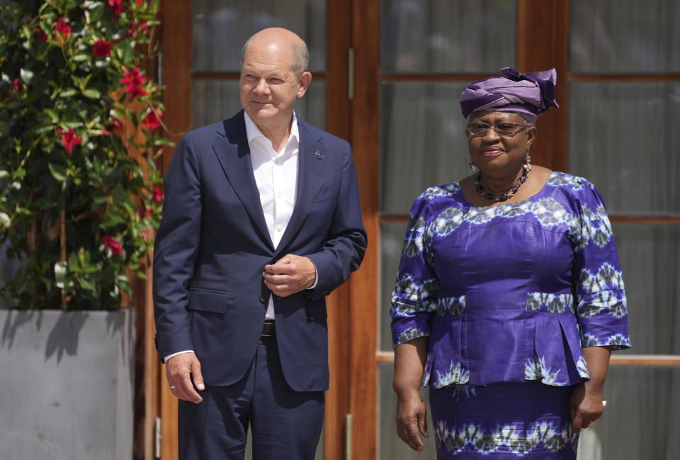 German Chancellor Olaf Scholz, left, greets World Trade Organization Director-General Ngozi Okonjo-Iweala during the official welcome ceremony of G7 leaders and Outreach guests at Castle Elmau in Kruen, near Garmisch-Partenkirchen, Germany, on Monday, June 27, 2022. The Group of Seven leading economic powers are meeting in Germany for their annual gathering Sunday through Tuesday. (AP Photo/Matthias Schrader)