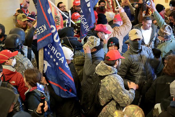 WASHINGTON, DC - JANUARY 06: Protesters gather inside the U.S. Capitol Building on January 06, 2021 in Washington, DC. Congress held a joint session today to ratify President-elect Joe Biden's 306-232 Electoral College win over President Donald Trump. A group of Republican senators said they would reject the Electoral College votes of several states unless Congress appointed a commission to audit the election results. (Photo by Win McNamee/Getty Images)