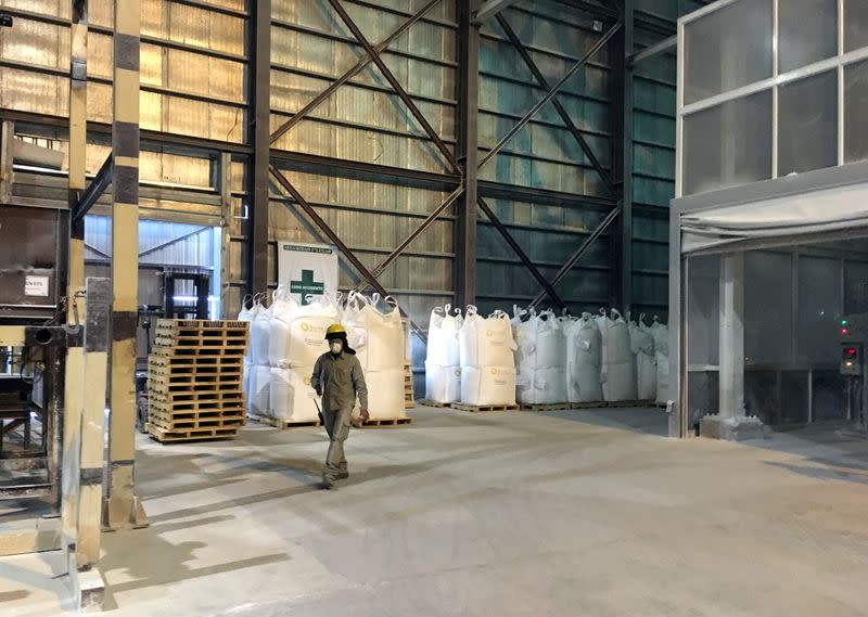 FILE PHOTO: A worker is seen at a lithium carbonate processing plant at a salt flat of Cauchari Olaroz near Susques